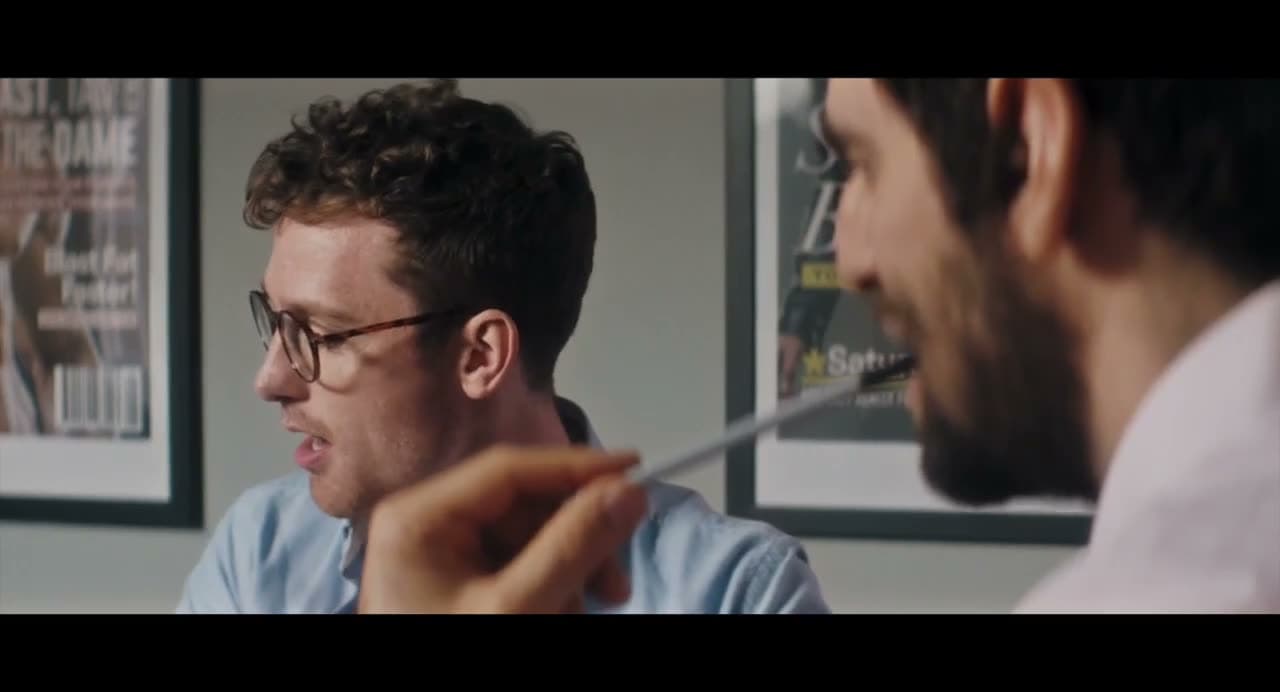 Christopher Adams in glasses in a magazine office